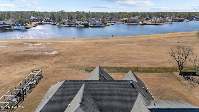 birds eye view of property featuring a water view