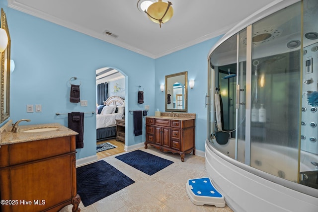 bathroom with two vanities, visible vents, crown molding, and a sink