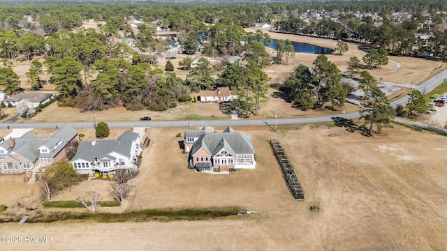 birds eye view of property with a residential view and a water view