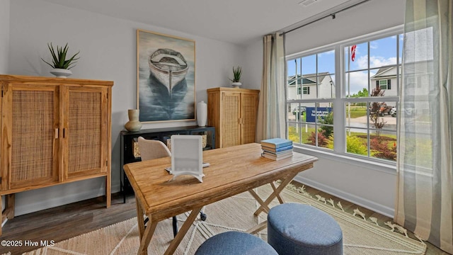 office space featuring wood finished floors and baseboards