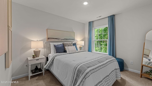 bedroom featuring visible vents, carpet floors, and baseboards