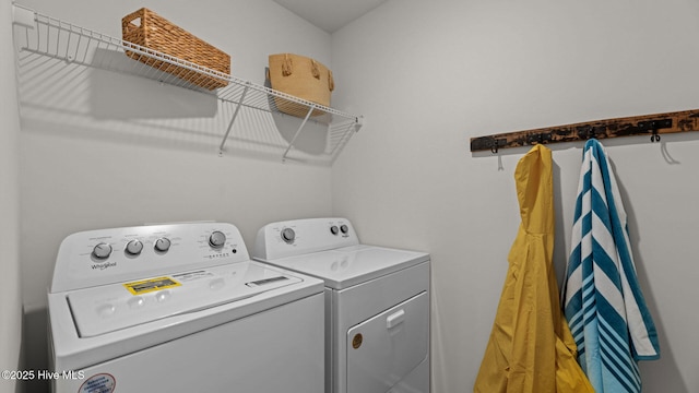 laundry room with washer and dryer and laundry area