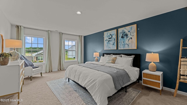 bedroom featuring baseboards and carpet floors