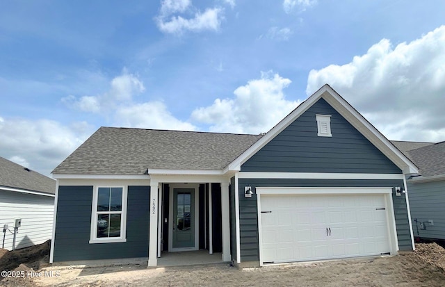 7592 Gorse Dr Unit 54, Leland, NC 28479 - single story home with driveway, a garage, and roof with shingles