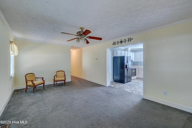 unfurnished room featuring carpet floors, a textured ceiling, and crown molding