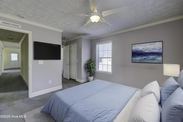 carpeted bedroom with visible vents, a textured ceiling, baseboards, and ornamental molding