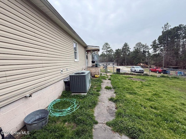 view of yard with central air condition unit