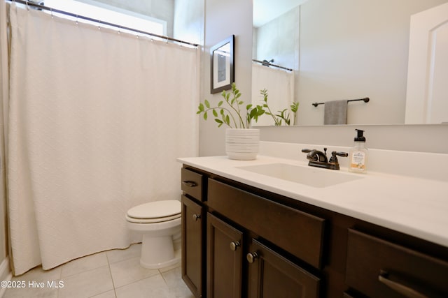 bathroom featuring vanity, tile patterned floors, toilet, and a shower with curtain