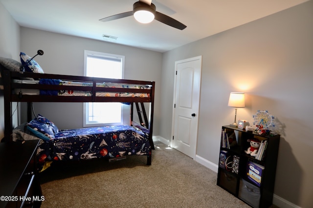 bedroom featuring visible vents, multiple windows, baseboards, and carpet