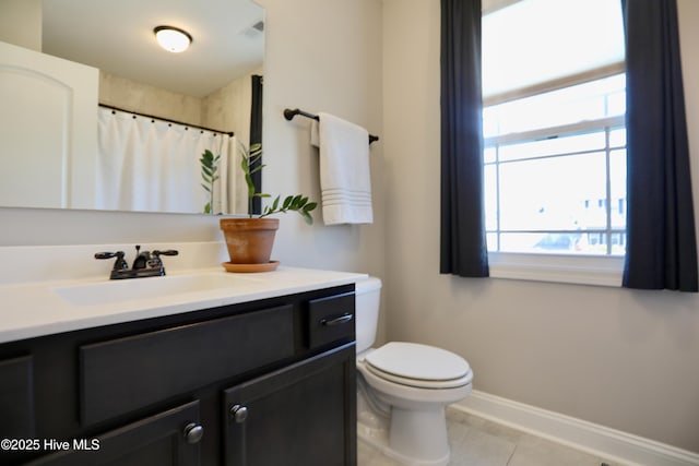 bathroom with baseboards, toilet, a shower with shower curtain, tile patterned floors, and vanity