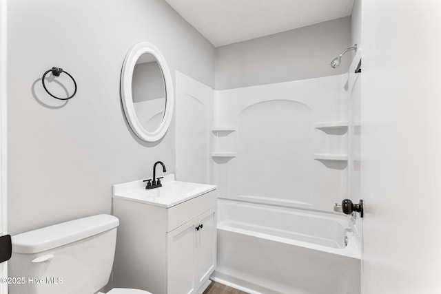 full bath with toilet, vanity, and washtub / shower combination