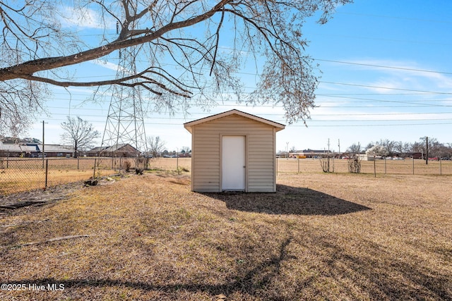 view of shed featuring fence