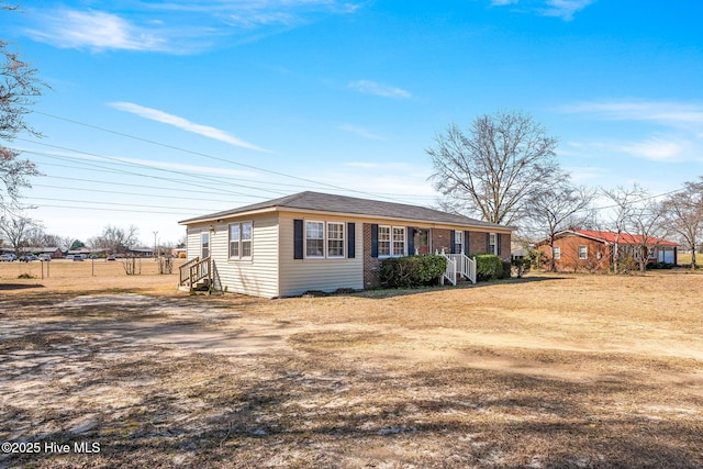 ranch-style house with brick siding