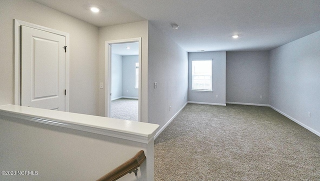 carpeted spare room with recessed lighting and baseboards