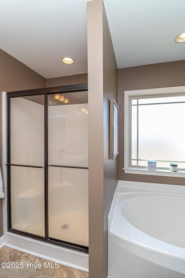 full bathroom with a garden tub, recessed lighting, and a stall shower