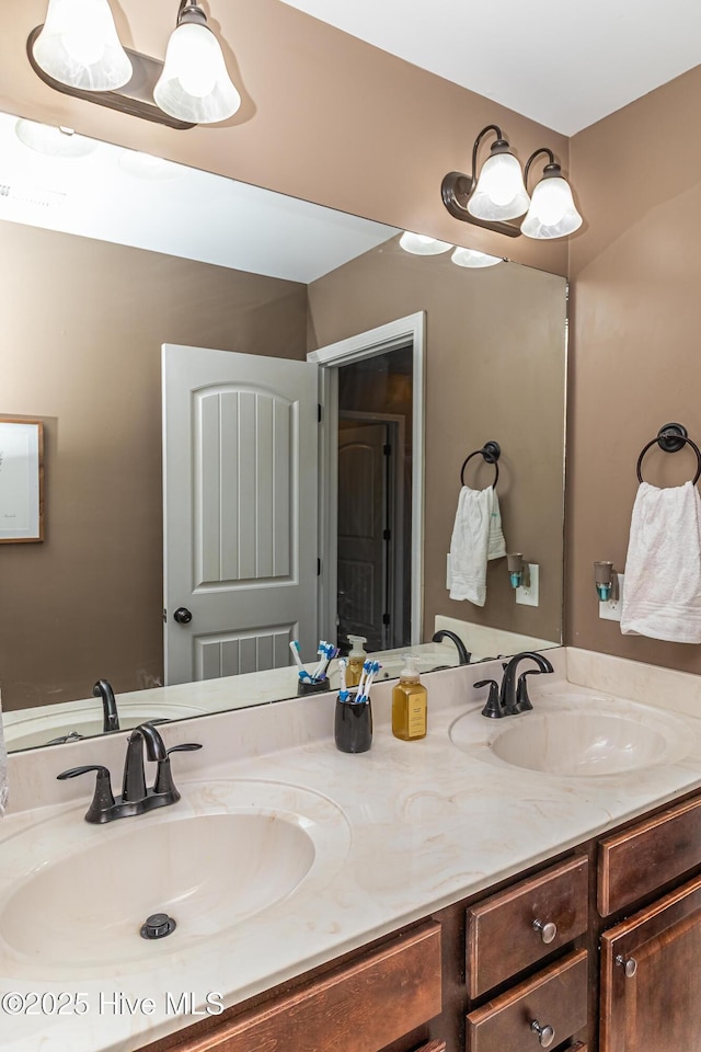 full bath with a sink and double vanity