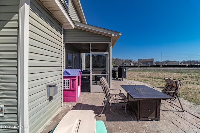 view of patio / terrace with a sunroom