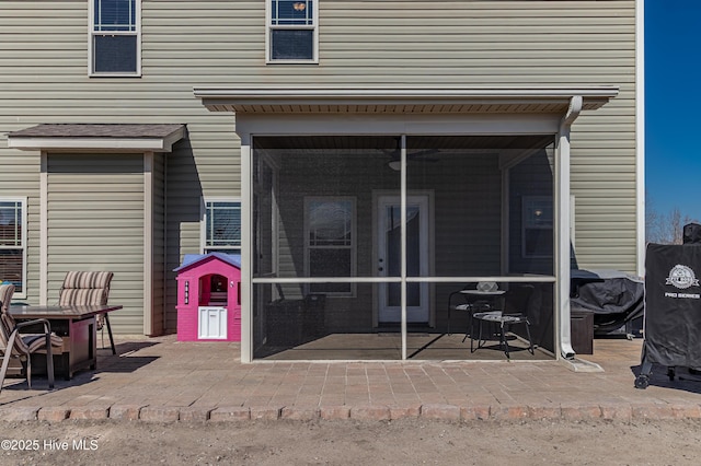 property entrance with a patio