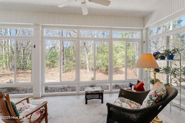 sunroom featuring ceiling fan