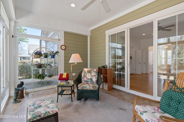 sunroom / solarium with ceiling fan