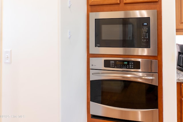 details with stainless steel oven and built in microwave