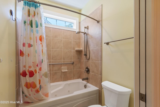 bathroom with toilet and shower / bath combo with shower curtain