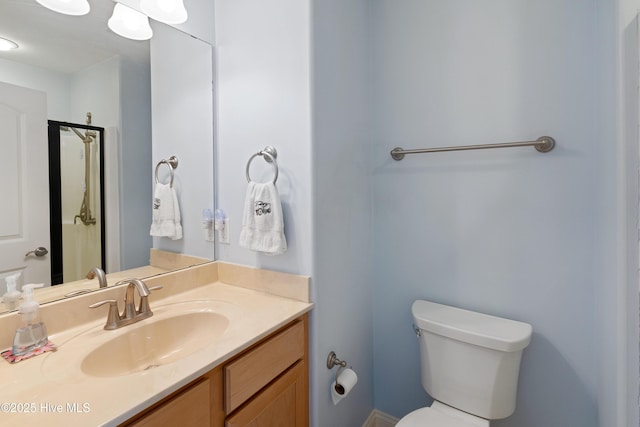 bathroom with toilet and vanity