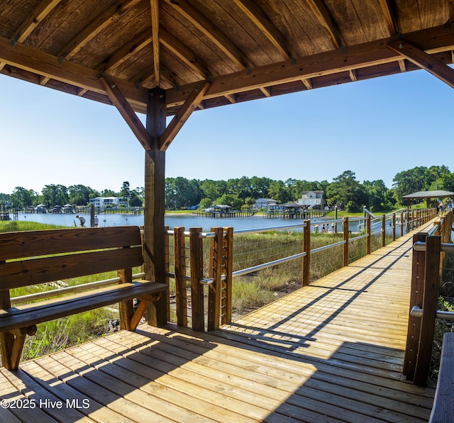 wooden deck with a water view