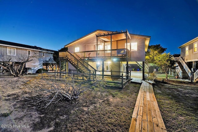 back of house at night with stairway