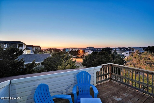 deck at dusk with a residential view