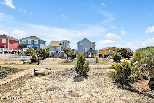 surrounding community featuring a residential view and fence