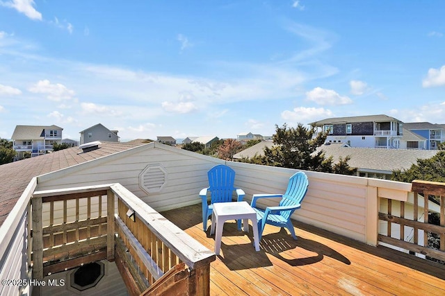 wooden terrace with a residential view