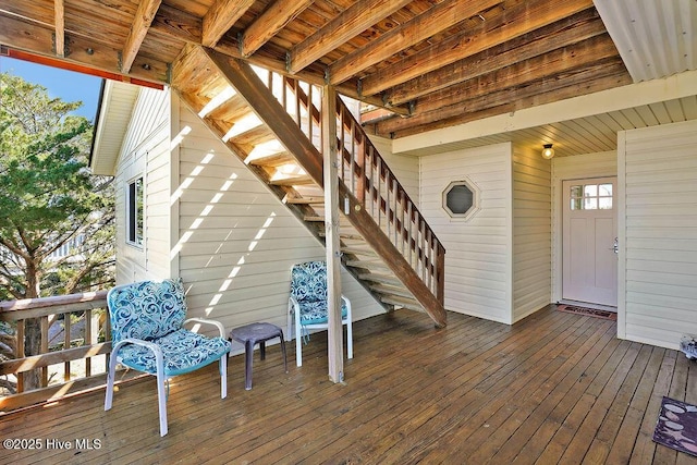 wooden deck featuring stairs