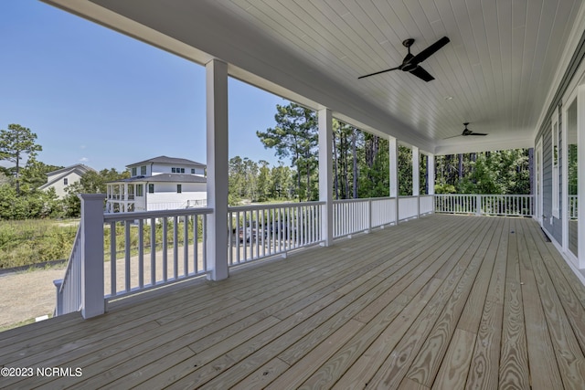 wooden deck featuring ceiling fan