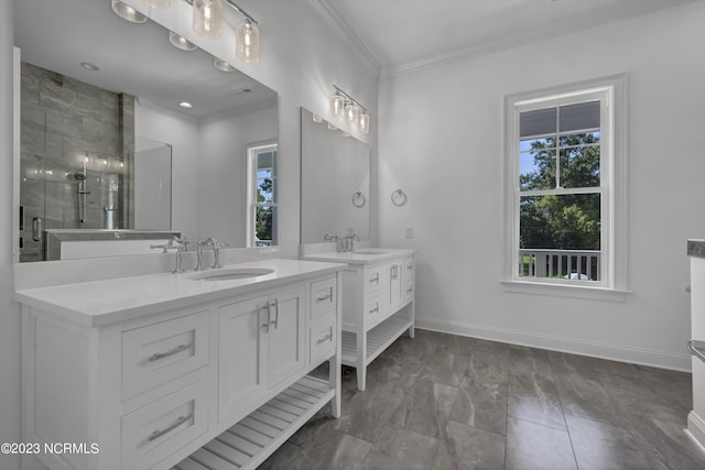 full bathroom featuring a sink, two vanities, a stall shower, and crown molding