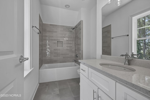 bathroom featuring vanity, shower / tub combination, toilet, and tile patterned flooring