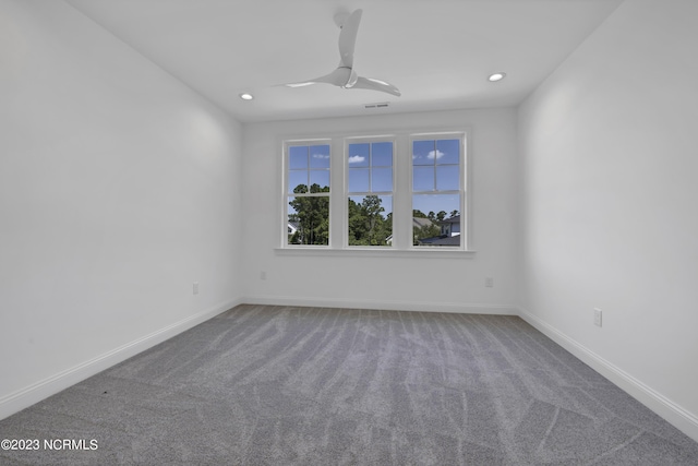 empty room featuring recessed lighting, carpet flooring, visible vents, and baseboards