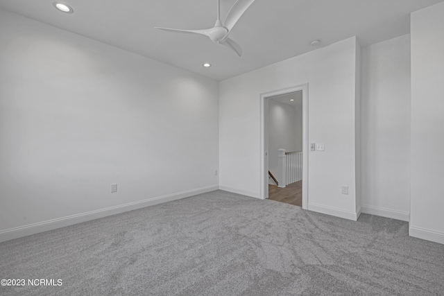 carpeted empty room with recessed lighting, baseboards, and a ceiling fan