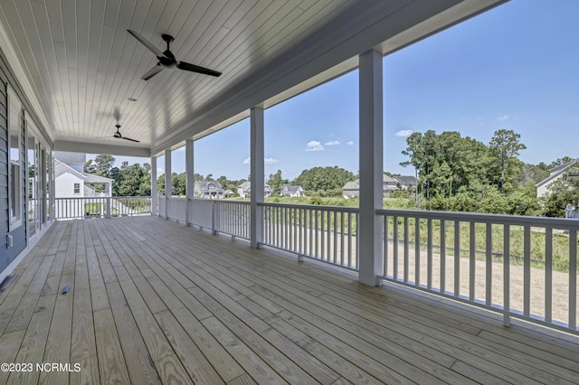 wooden deck featuring ceiling fan