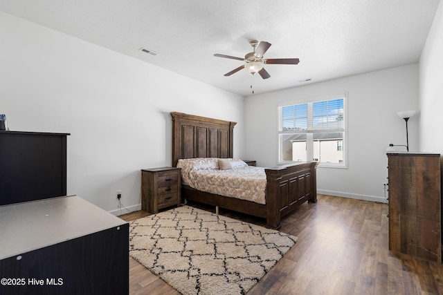 bedroom with light wood-style flooring, baseboards, and visible vents