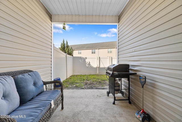 view of patio / terrace with grilling area and a fenced backyard