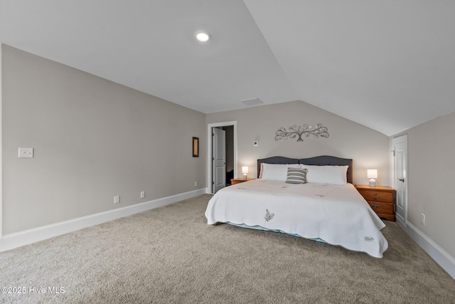 unfurnished bedroom with baseboards, lofted ceiling, and carpet floors