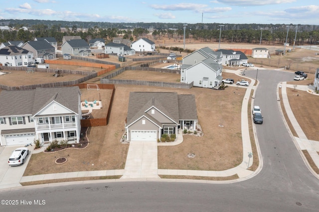 birds eye view of property with a residential view