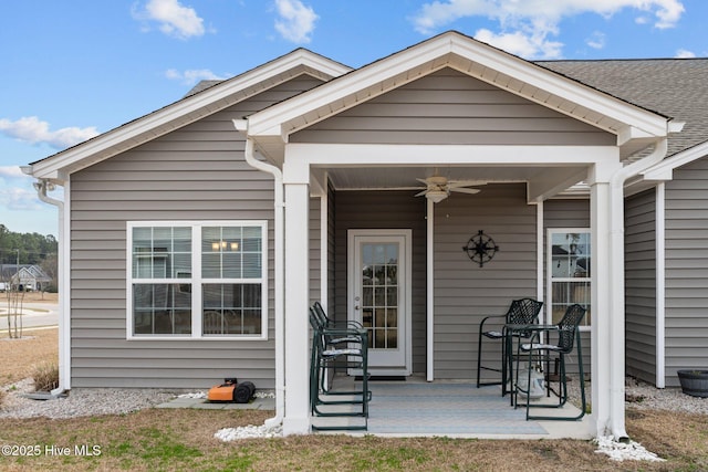 property entrance featuring a ceiling fan