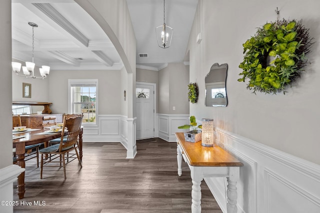 entrance foyer with visible vents, coffered ceiling, beam ceiling, dark wood-type flooring, and a chandelier