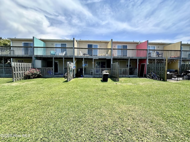 exterior space with a lawn and fence