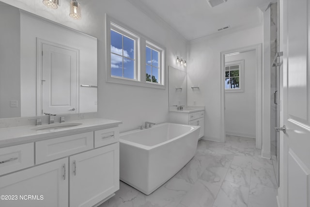 full bath with visible vents, ornamental molding, a freestanding tub, marble finish floor, and a sink