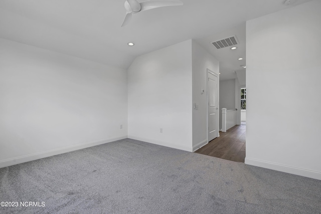 carpeted empty room featuring recessed lighting, baseboards, visible vents, and ceiling fan