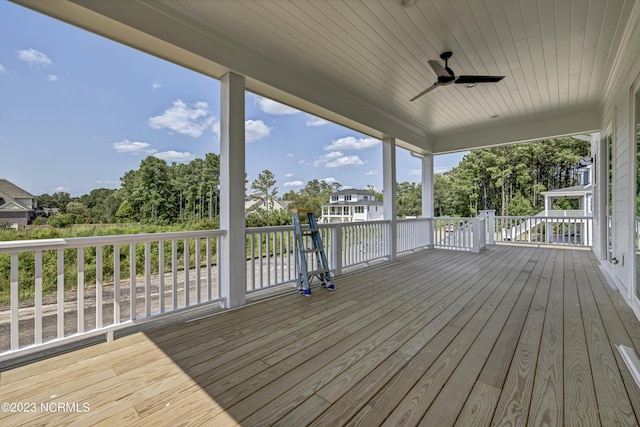 wooden terrace featuring ceiling fan