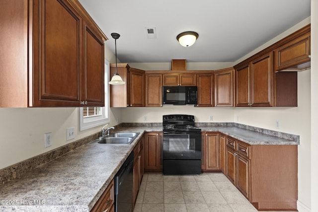 kitchen with light tile patterned floors, visible vents, a sink, black appliances, and decorative light fixtures